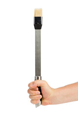 A hand holds a basting brush.