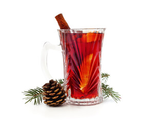 Cup of mulled wine and a branch of a Christmas tree with a cone.