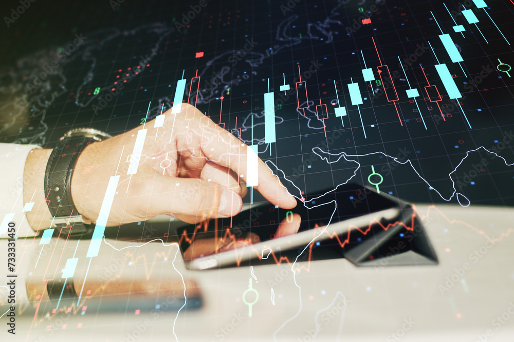 Poster multi exposure of abstract financial diagram with world map and hand working with a digital tablet o