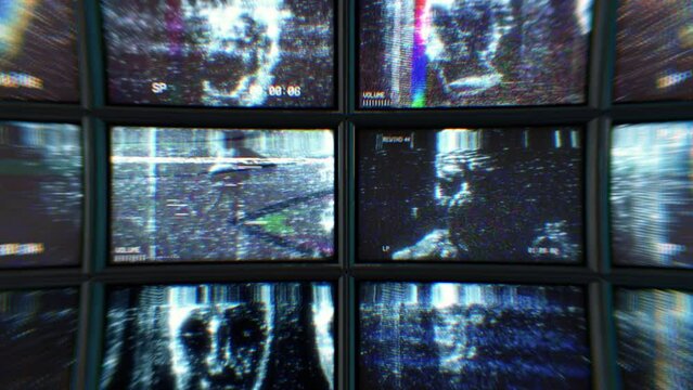 Wall of CCTV screens with scary faces distorted footage
