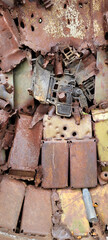 background of rusty remains of rockets, mines, bombs, cartridges fastened together, symbols of war