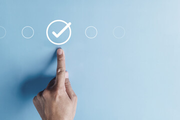 approval, approved, check, checkmark, choice, choose, confirm, correct, cross, decision. pointing at correct marks in round via finger on blue background color, the concept of choice without people.