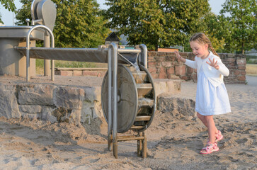 Child at Playground Water Pump