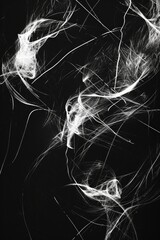 A black and white photo capturing smoke in the air. This image can be used to depict mystery, pollution, or a dramatic atmosphere.