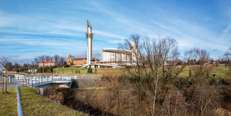 Krakow, Poland . Sanctuary of  Saint Fautsine and Church of Divine Mercy. Park and bridge over Wilga river. Winter panorama - 733366065