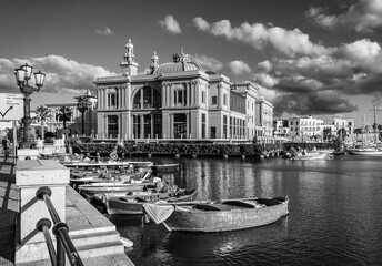 Docked boats with the Margherita Theatre in background, Bari, Puglia region (Apulia), southern Italy, Europe, September 17, 2022