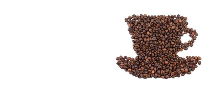 A pile of coffee beans in the shape of a coffee cup, on a white background. Top view.