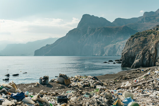 there is a lot of garbage on the island among the mountains, pollution of nature
