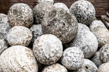 Pile of Ancient Stone Cannonballs from Historical Era