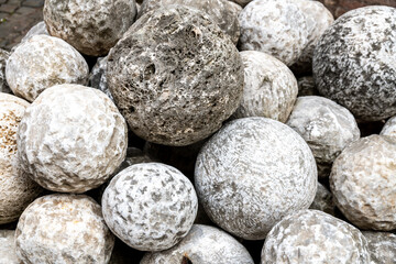 Pile of Ancient Stone Cannonballs from Historical Era
