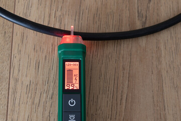 AC voltage detector, instrument for checking electricity in electrical cables without direct...
