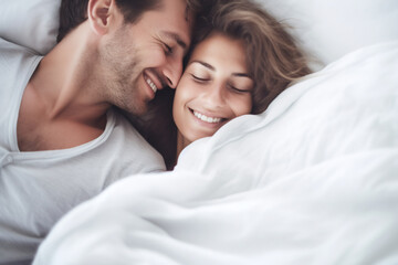 Happy couple, hug in bed and love with cuddle and romance at home for relationship, smile and bonding. Young people, woman and man relax in bedroom, intimacy and laughing with kiss and talk together