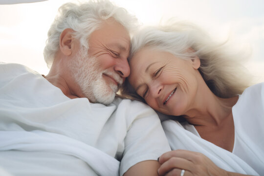 Senior, cuddle and happy couple in bed, care and embrace together in home. Love, elderly man and woman in bedroom for connection, support and healthy relationship, conversation or relax in retirement