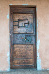 Ancient Wooden Door with Iron Lock in Historic Building