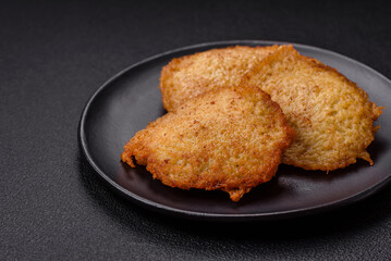 Delicious crispy pancakes made from potatoes, meat, carrots, onions