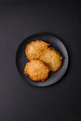 Delicious crispy pancakes made from potatoes, meat, carrots, onions