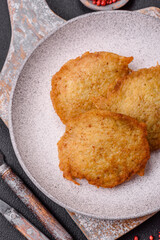 Delicious crispy pancakes made from potatoes, meat, carrots, onions