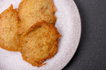 Delicious crispy pancakes made from potatoes, meat, carrots, onions