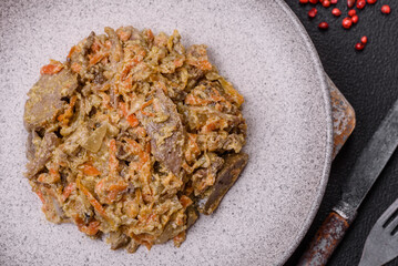 Delicious boiled beef or pork tongue sliced with carrots, onions, sour cream and spices