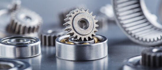 metal gears and bearings. Background with part of the mechanism.