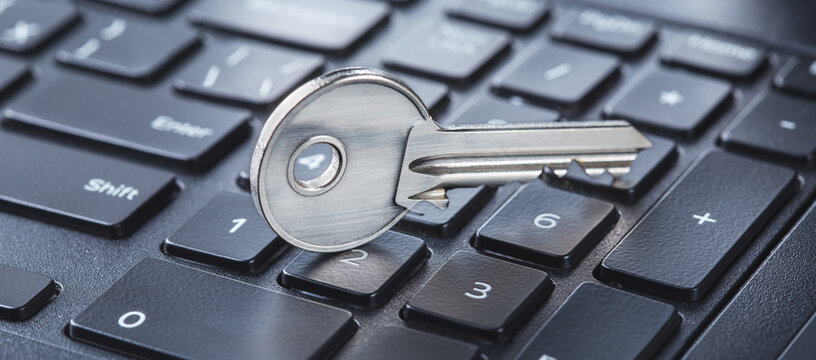 phishing, hacking personal data and money , key and hook on computer keyboard.