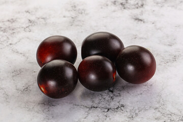 Raw ripe black kumato tomato