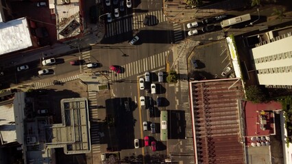 Cars traffic at crossroads. Auto road transport in city, top aerial view.