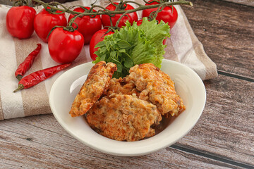 Fried salmonn cutlet in the bowl