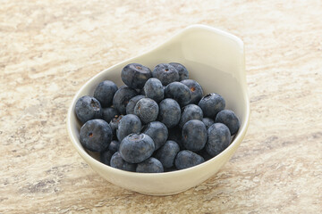 Sweet ripe blueberry heap in the bowl