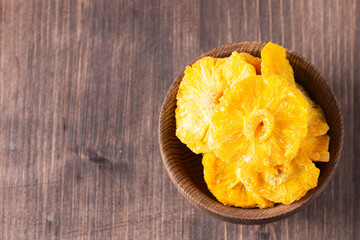Dried pineapple in a bowl. Dried fruits. 