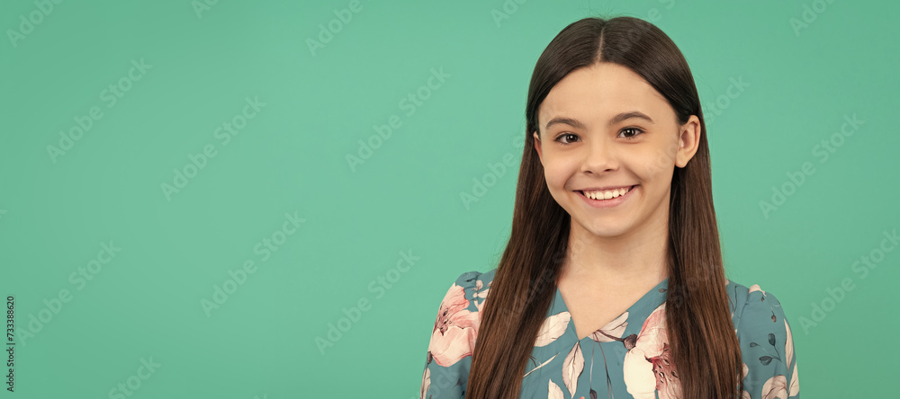 Wall mural happy school-aged child smile blue background. child face, horizontal poster, teenager girl isolated