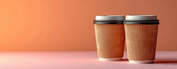 Fotobehang Two paper coffee cups on orange background. Mock up © foto.katarinka