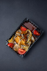 Thai food delivery on a dark background. Vegetarian dish