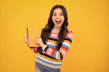 Amazed teenager. Teenager school girl with books isolated studio background. Excited teen girl.