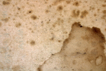 Old battered paper texture or background