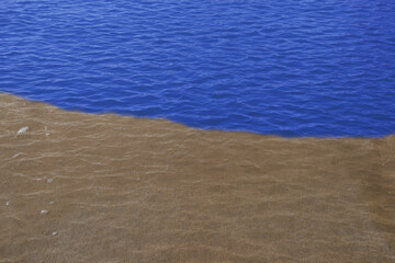 clear sandy beach with blue ocean water. beautiful desert lake 