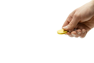 Fototapeta premium Male hand holding chocolate coin, stack of coins in the background isolated on white background, copy space