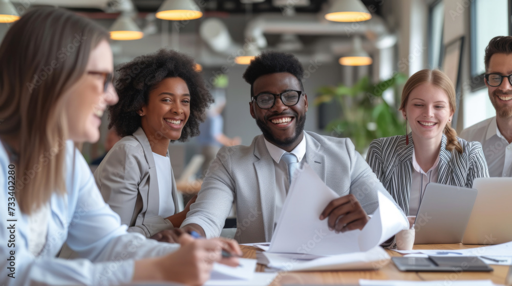 Poster group of diverse professionals engaging in a collaborative and lively discussion around a table in a
