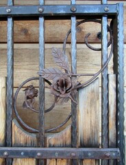 Forged metal fence decorated with wrought-iron decorative roses. Leavenworth, WA, USA