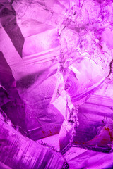 Amehtyst macro photography detail texture background. close-up raw rough unpolished semi-precious...