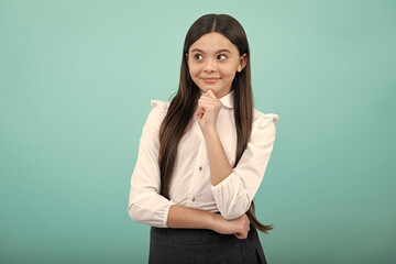 Beautiful teenager child over isolated yellow background with hand on chin thinking about question, thoughtful face. Doubt concept.