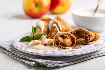 Thin pancakes with apples.
