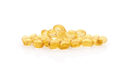 Heap of yellow oval capsules with vitamins or dietary supplement inside isolated on white background. Omega 3 fatty acid for beauty and health.