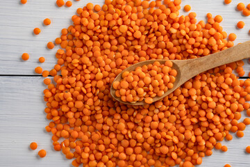 Uncooked lentils on white wooden background