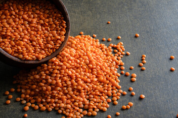 Uncooked lentils on black background