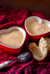 we love soup. Two heart shaped bowls hold creamy potato leek soup with crisp toast cut into heart shapes