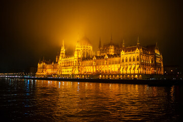 Fototapeta premium Parliament building in Budapest, Hungary at Night. Danube river and City at night