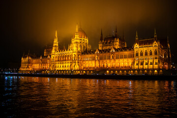 Fototapeta premium Parliament building in Budapest, Hungary at Night. Danube river and City at night