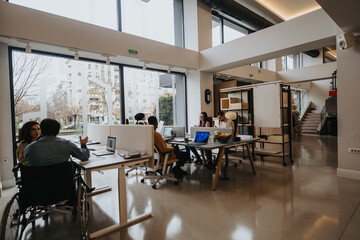 A bright, contemporary office space with a diverse group of professionals working together....