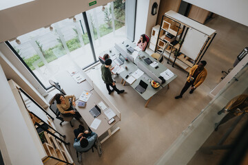 An high angle view of a contemporary office setting with a diverse group of professionals engaging in daily business activities.
